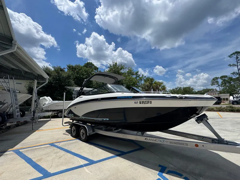 Slide: The Image of 2015 Yamaha Boats AR240 HO on trailer under a partly cloudy sky. - 9