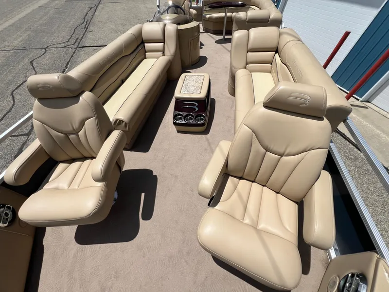 Slide: The Image of Luxurious interior of a 2008 Bennington R25 boat with beige leather seating. - 11