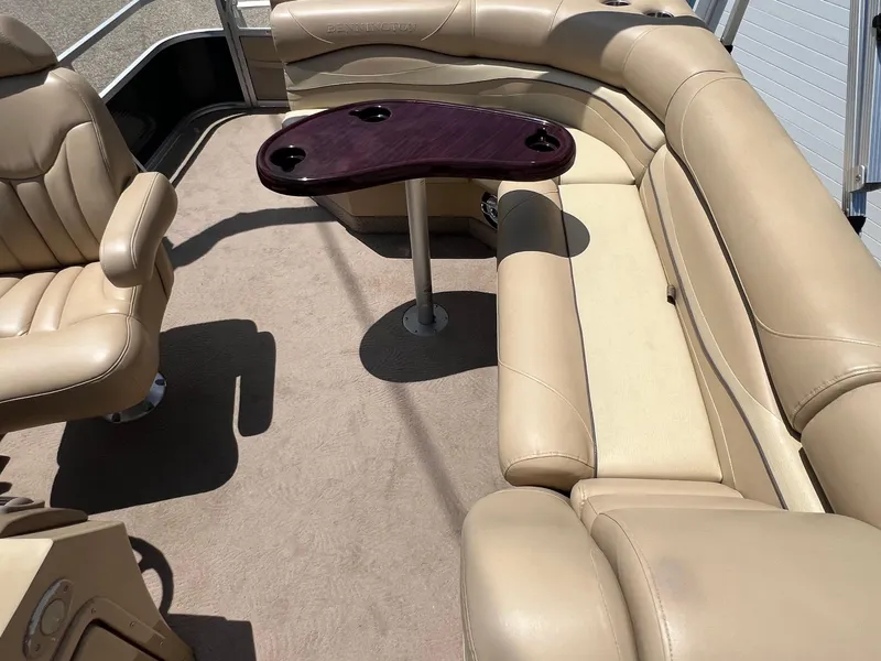 Slide: The Image of Luxurious beige seating on 2008 Bennington R25 boat with a wooden table. - 24
