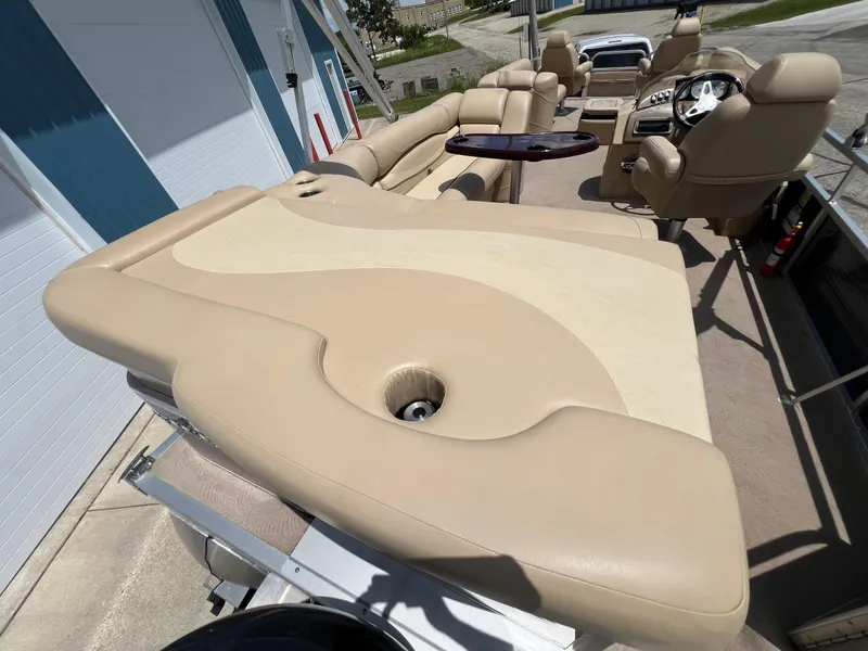 Slide: The Image of 2008 Bennington R25 boat interior with beige seating and steering console. - 31
