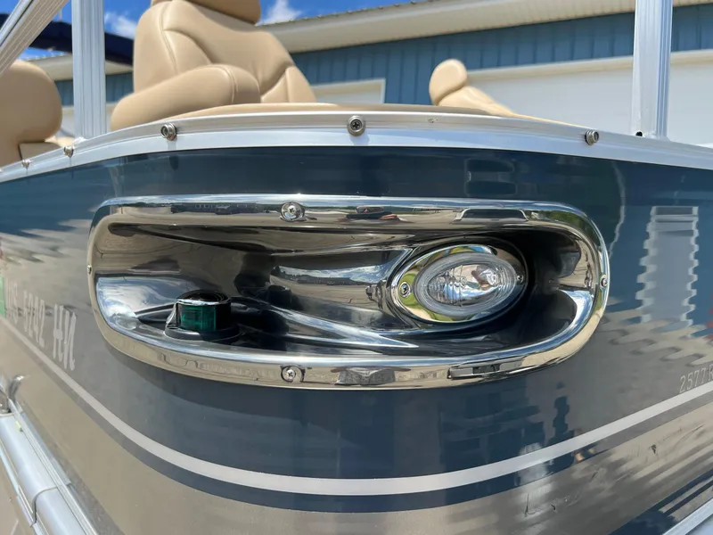 Slide: The Image of 2008 Bennington R25 boat detail with chrome trim and navigation light. - 4