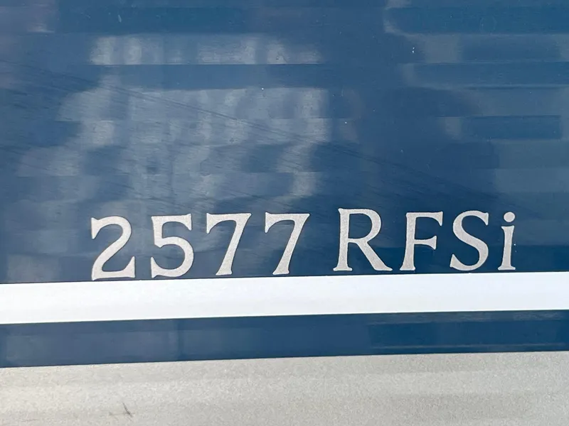 Slide: The Image of Close-up of 2008 Bennington R25 boat model number 2577 RFSI on blue background. - 8