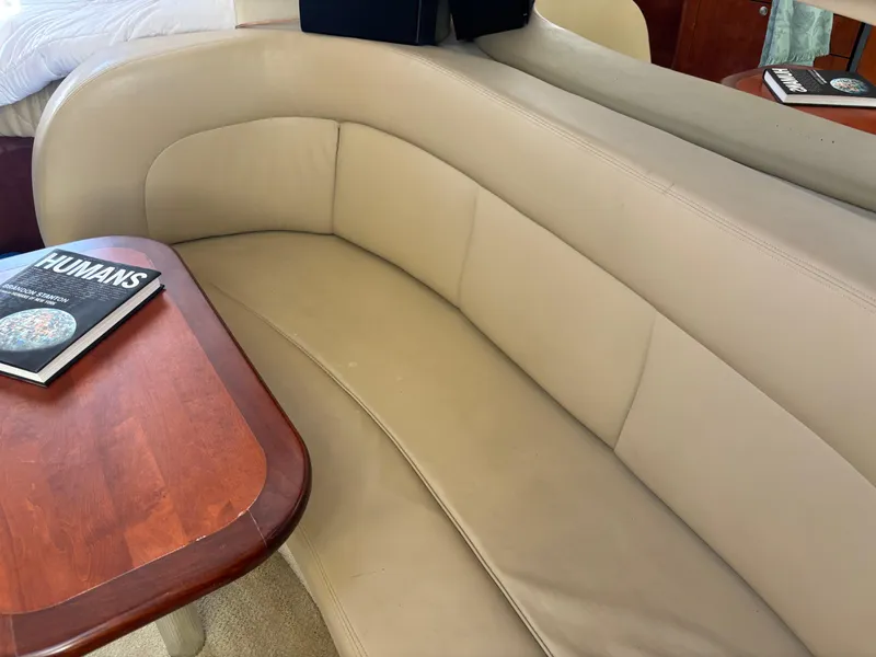 Slide: The Image of Beige leather seating and wooden table inside 2006 Sea Ray 300 Sundancer yacht. - 13