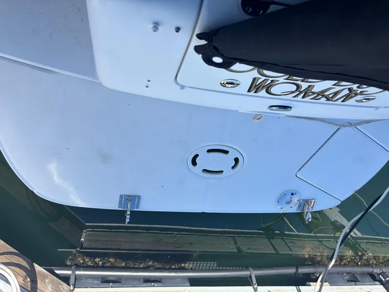 Slide: The Image of Rear view of a 2006 Sea Ray 300 Sundancer boat docked at a marina. - 3