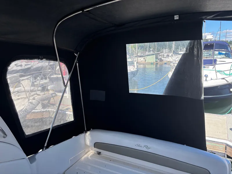 Slide: The Image of 2006 Sea Ray 300 Sundancer interior with marina view through windows. - 4