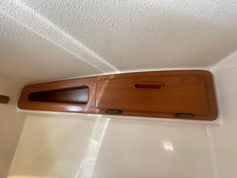 Slide: The Image of Wooden cabinet detail inside 1995 Island Packet 40 sailboat, featuring a sleek design. - 30