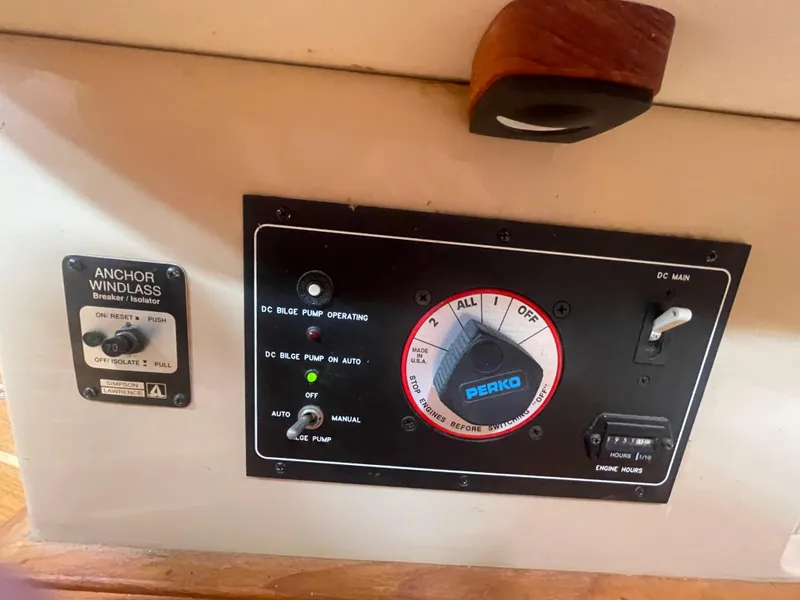 Slide: The Image of Control panel of a 1995 Island Packet 40 sailboat with anchor windlass and bilge pump switches. - 38