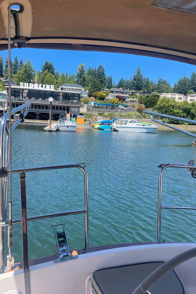 Slide: The Image of Sailboat view of marina with shoreline buildings, Island Packet 40, 1995 model. - 47