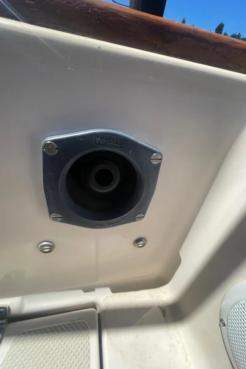 Slide: The Image of Deck fitting on a 1995 Island Packet 40 sailboat, featuring a Whale brand component. - 9