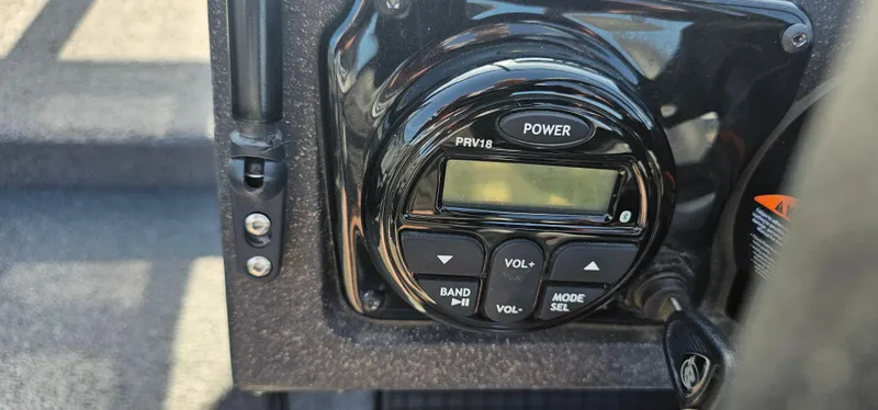 Slide: The Image of Close-up of Tracker Tagra V19 2022 control panel with buttons and display. - 11