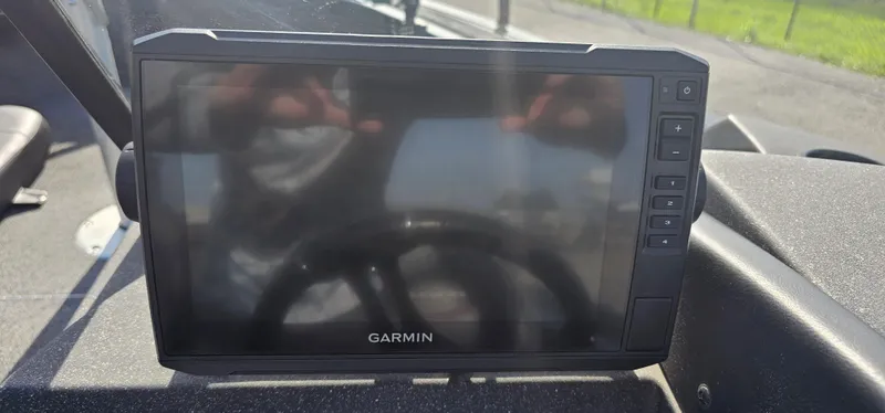 Slide: The Image of Garmin display on 2022 Tracker Tagra V19 dashboard, reflecting sunlight. - 12