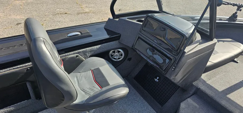 Slide: The Image of Interior of 2022 Tracker Tagra V19 boat with seating and dashboard. - 17