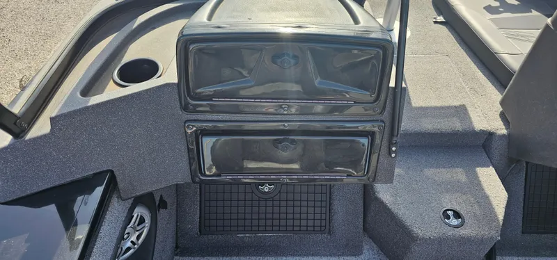 Slide: The Image of 2022 Tracker Tagra V19 boat interior with storage compartments and seating area. - 18