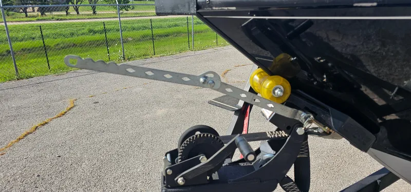 Slide: The Image of Trailer hitch mechanism of a 2022 Tracker Tagra V19 on pavement background. - 4