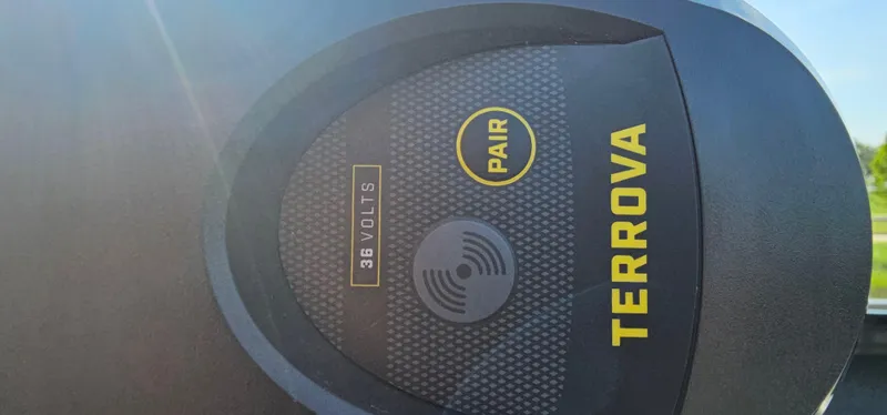 Slide: The Image of Close-up of a 2022 Tracker Tagra V19 Terrova motor, showing 36 volts and pairing feature. - 6