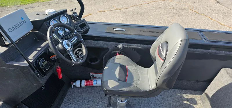 Slide: The Image of Interior of 2022 Tracker Tagra V19 boat with Garmin navigation system and steering wheel. - 9