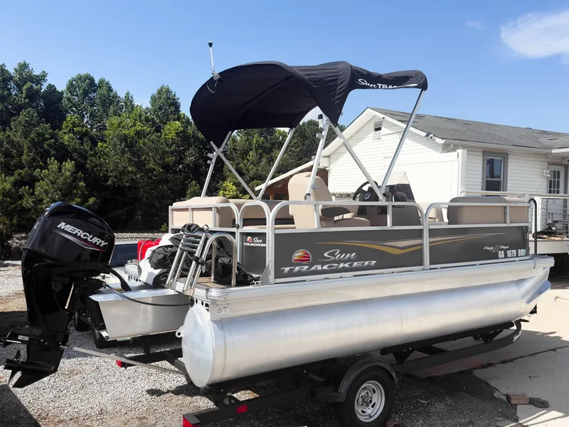 Slide: The Image of 2025 Sun Tracker Party Barge 16 DLX pontoon boat with Mercury outboard motor. - 3