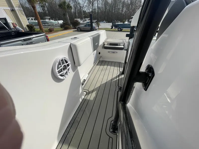 Slide: The Image of 2024 Robalo R200 Center Console boat interior with seating and speaker. - 10