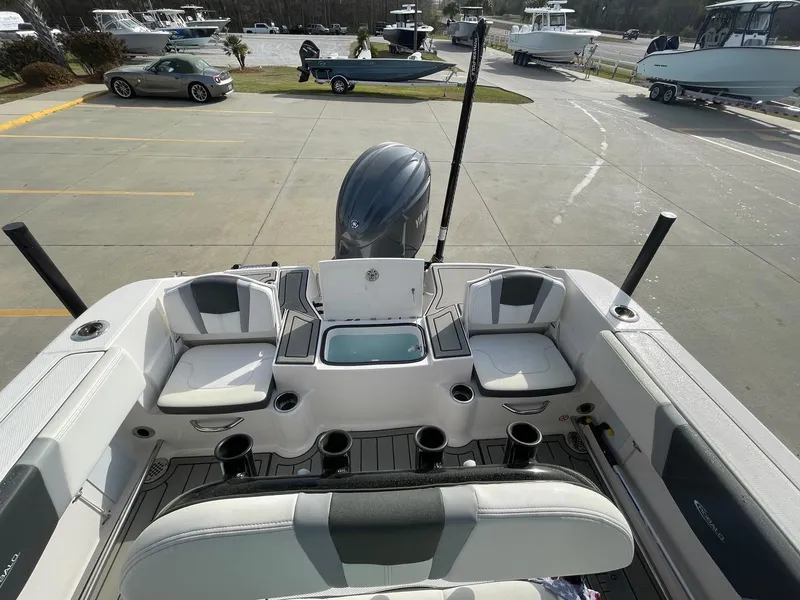 Slide: The Image of 2024 Robalo R200 Center Console boat interior with seating and storage compartments. - 13