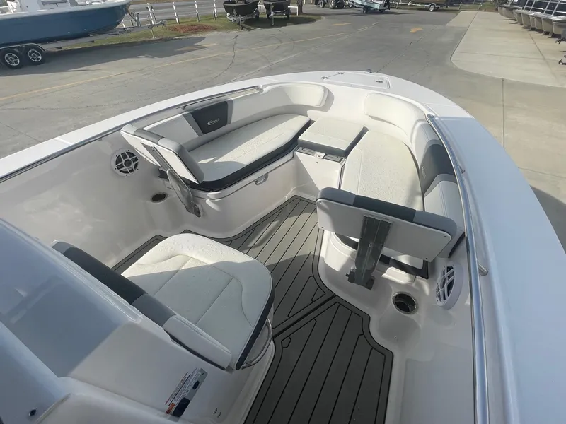Slide: The Image of 2024 Robalo R200 Center Console boat interior with cushioned seating and modern design. - 16