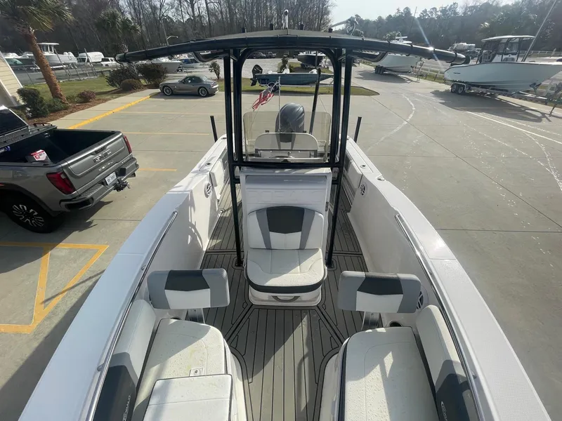 Slide: The Image of 2024 Robalo R200 Center Console boat with spacious seating and modern design. - 6