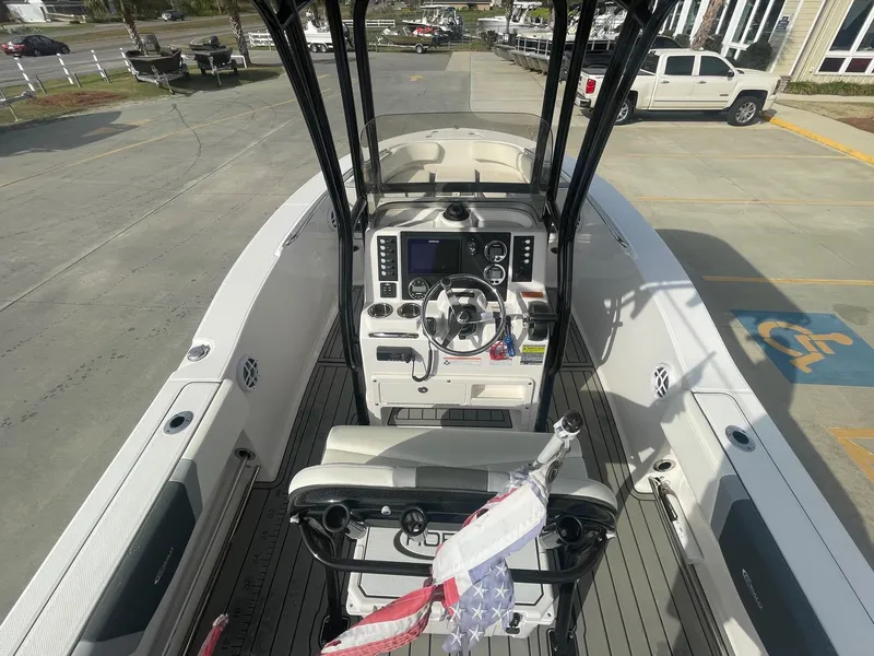 Slide: The Image of 2024 Robalo R200 Center Console boat interior with steering wheel and control panel. - 7