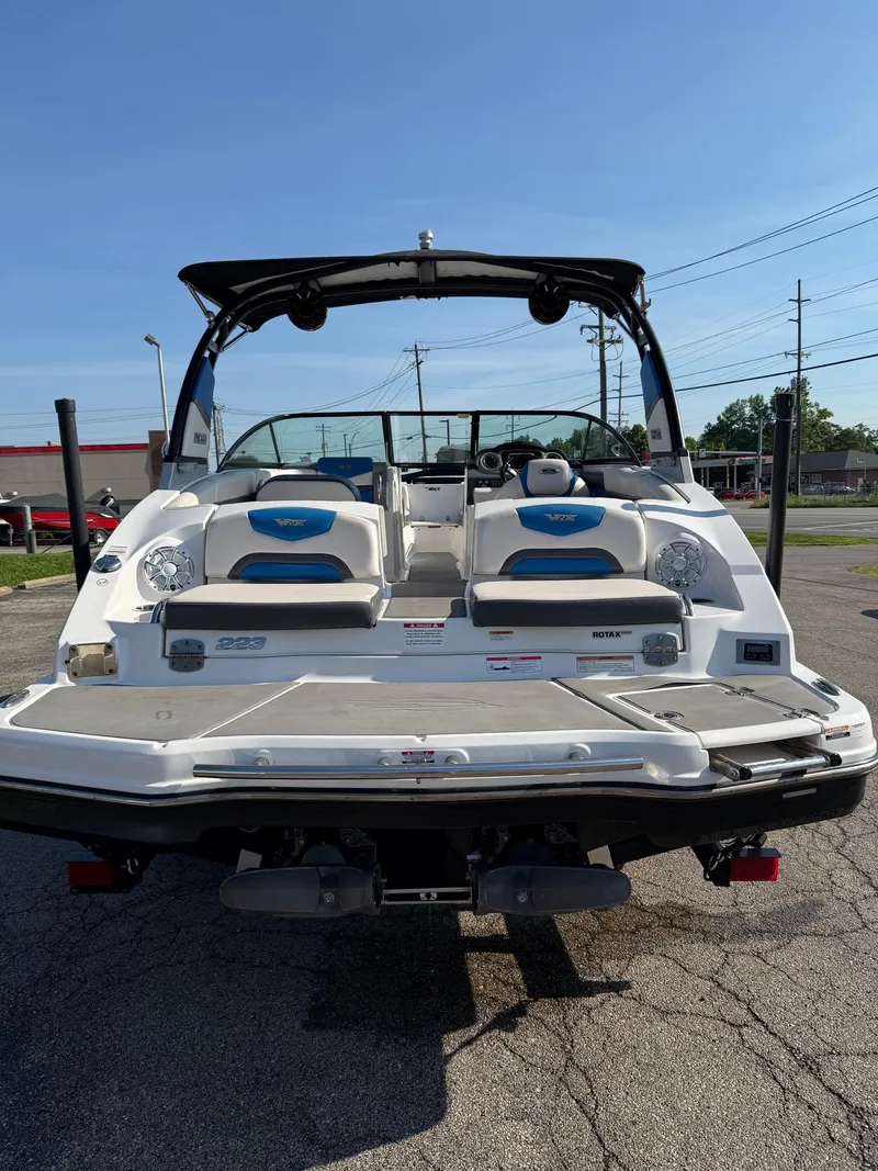 Slide: The Image of 2018 Chaparral Vortex 223 VRX boat, rear view, parked on pavement. - 10