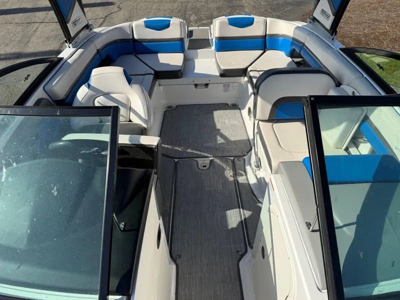 Slide: The Image of 2018 Chaparral Vortex 223 VRX interior with blue and white seating, open bow design. - 2
