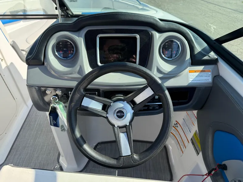 Slide: The Image of 2018 Chaparral Vortex 223 VRX dashboard with steering wheel and gauges. - 7