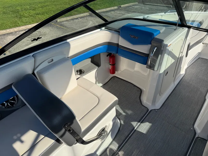 Slide: The Image of 2018 Chaparral Vortex 223 VRX boat interior with blue and white seating. - 9
