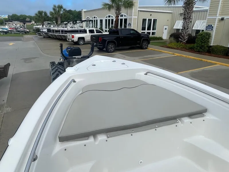 Slide: The Image of 2024 Key West 189 FS boat at dealership, featuring bow seating and modern design. - 7