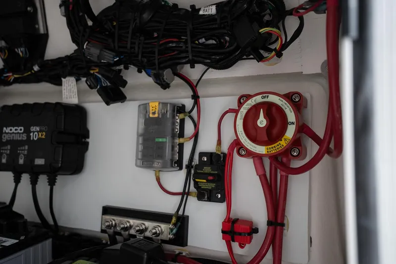 Slide: The Image of Electrical system of 2026 Twin Vee 22 Bay Cat boat with wiring and switches. - 16