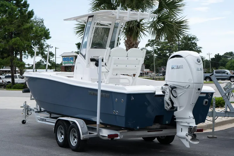 Slide: The Image of 2026 Twin Vee 22 Bay Cat boat on trailer, featuring Yamaha outboard motor. - 4