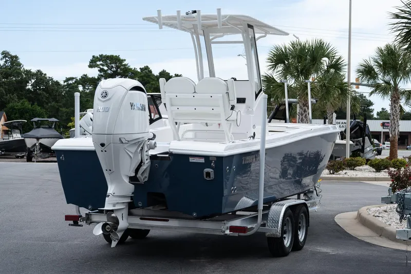 Slide: The Image of 2026 Twin Vee 22 Bay Cat boat on trailer, featuring Yamaha outboard motor. - 6