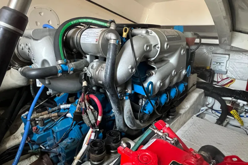 Slide: The Image of Engine of a 2015 Tiara Yachts 3100 Coronet, showcasing intricate mechanical components. - 13