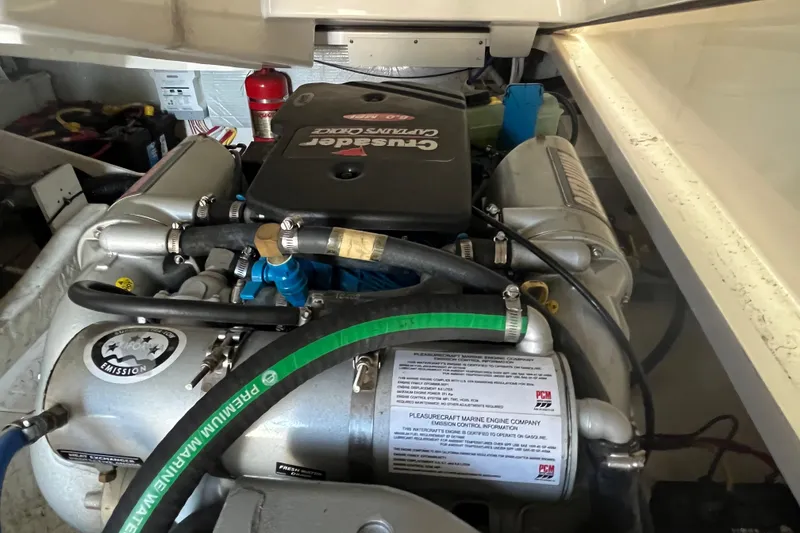 Slide: The Image of Engine compartment of a 2015 Tiara Yachts 3100 Coronet, featuring Crusader engine components. - 16