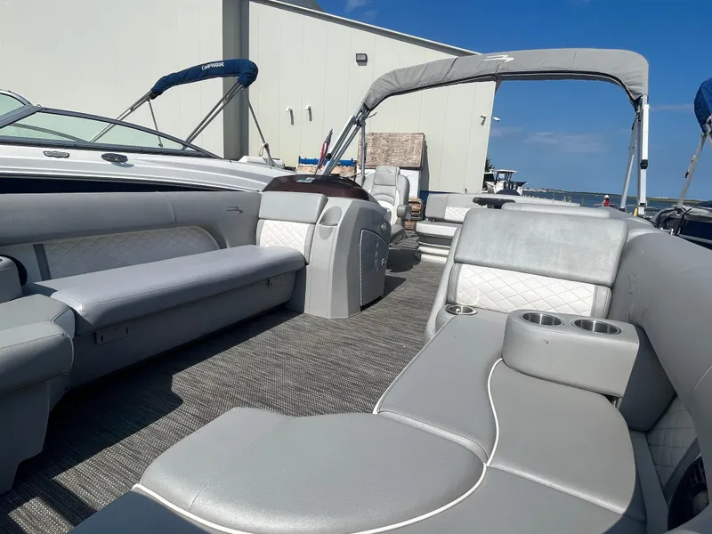 Slide: The Image of 2021 Bennington 23L pontoon boat with spacious seating and modern design. - 13