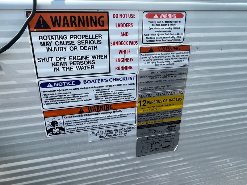 Slide: The Image of Safety warnings and capacity limits on a 2021 Bennington 23L boat. - 28