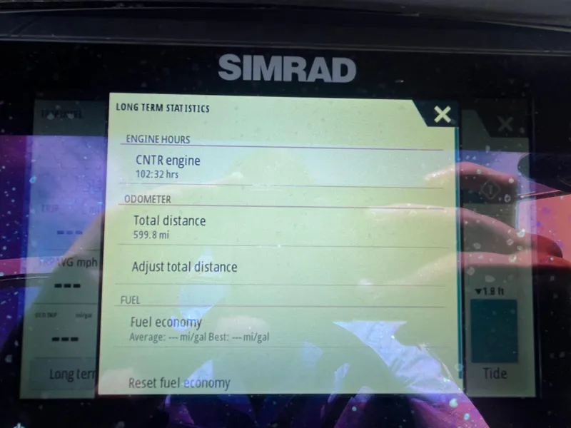 Slide: The Image of Simrad display showing engine hours and odometer for 2021 Bennington 23L boat. - 29