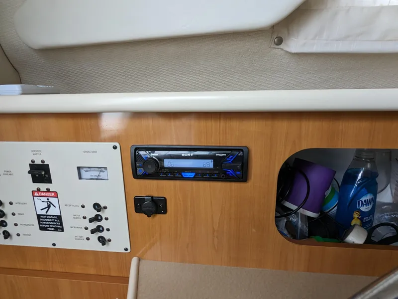 Slide: The Image of 2002 Bayliner 245 Ciera interior with control panel and Sony stereo system. - 18