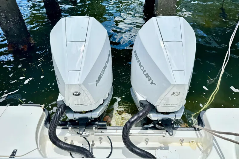 Slide: The Image of Twin Mercury outboard engines on a 2015 Boston Whaler 315 Conquest boat. - 17