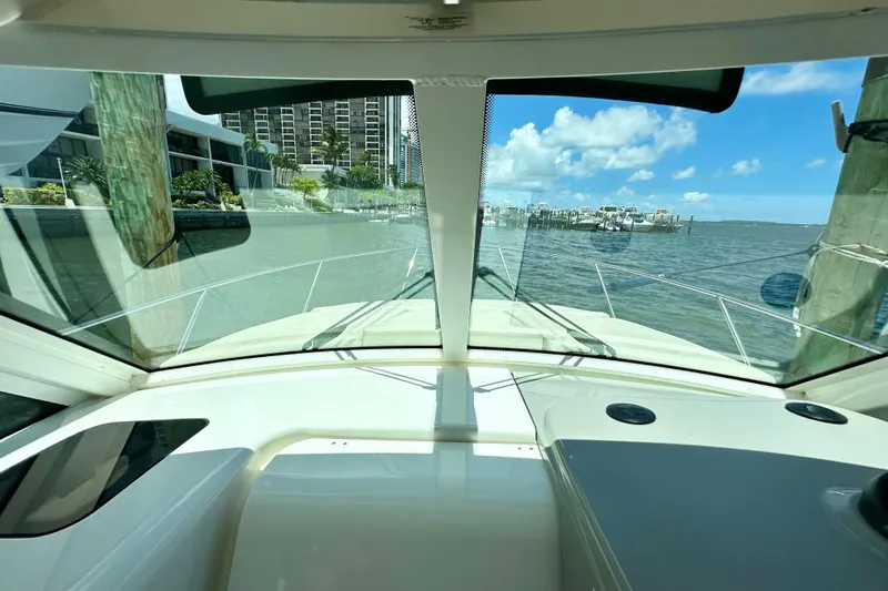 Slide: The Image of 2015 Boston Whaler 315 Conquest boat view from cockpit, overlooking marina and waterfront. - 27