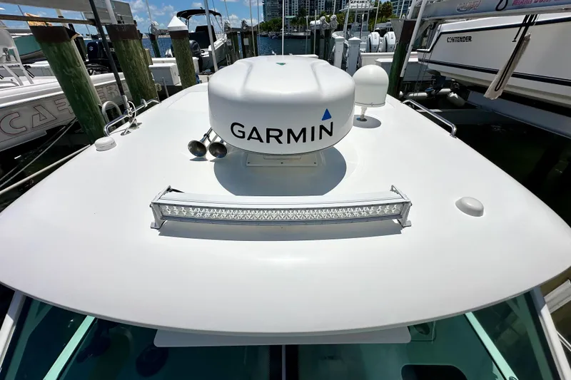 Slide: The Image of 2015 Boston Whaler 315 Conquest boat with Garmin radar and LED light bar. - 35