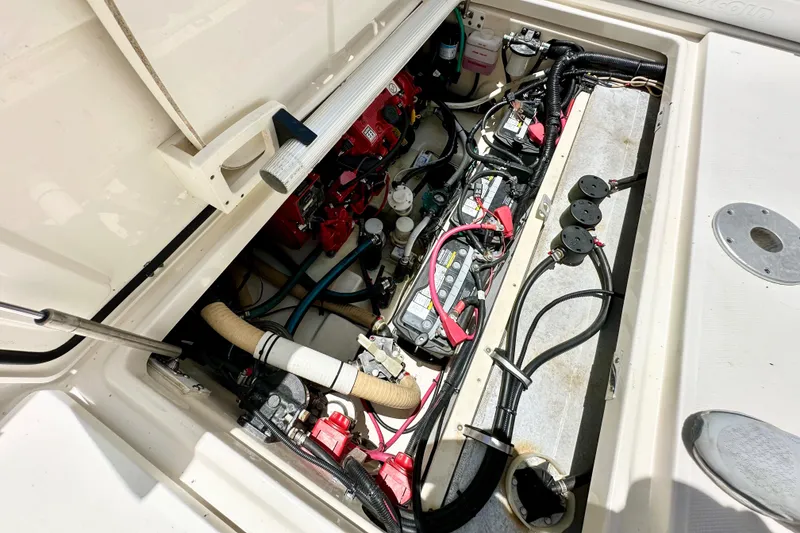 Slide: The Image of Engine compartment of a 2015 Boston Whaler 315 Conquest, showing wiring and components. - 38