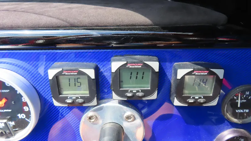 Slide: The Image of Dashboard of a 1995 Talon 36 Cat with Mercury SmartCraft gauges. - 15