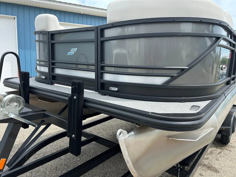 Slide: The Image of 2022 Starcraft CX21 pontoon boat on trailer, close-up view. - 17