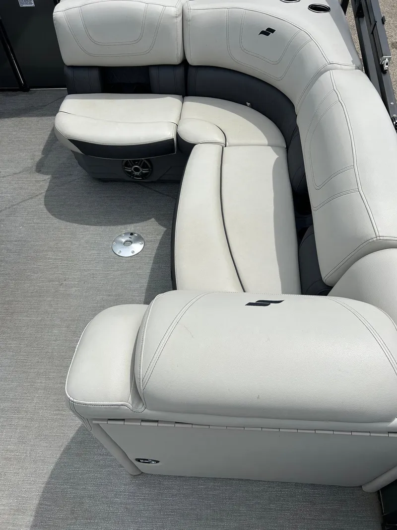 Slide: The Image of Luxurious seating on 2022 Starcraft CX21 boat, featuring plush, curved upholstery. - 24