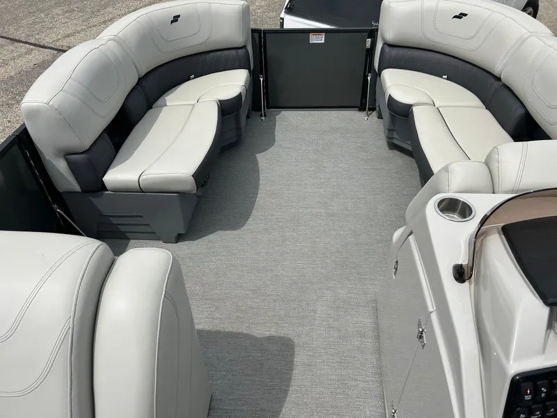 Slide: The Image of 2022 Starcraft CX21 boat interior with gray and white seating, spacious layout. - 28