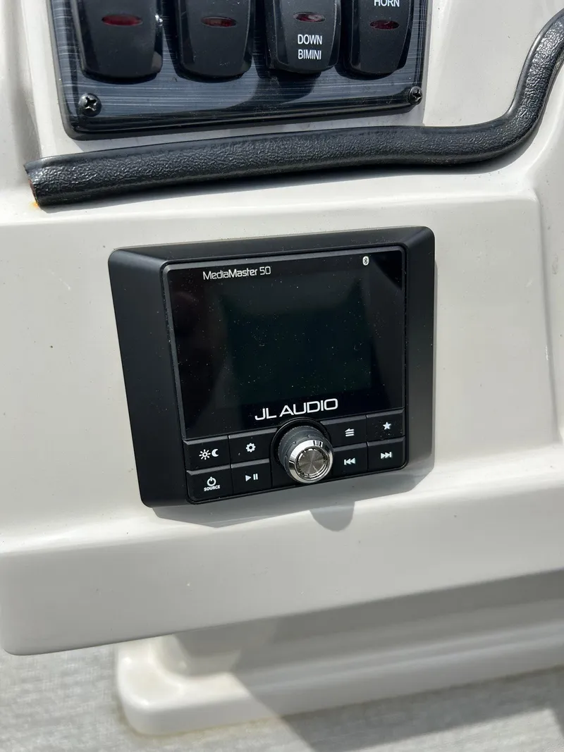 Slide: The Image of JL Audio MediaMaster 50 on 2022 Starcraft CX21 boat dashboard. - 31