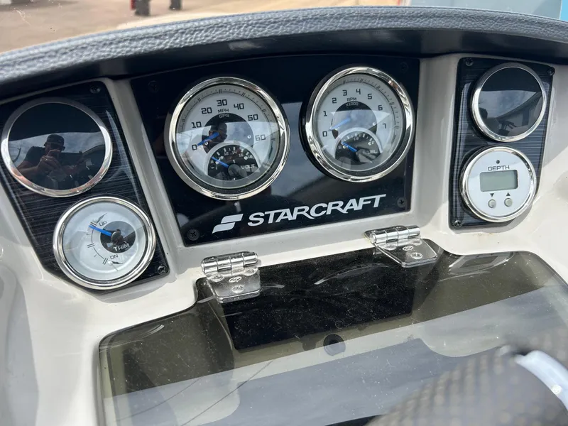 Slide: The Image of Dashboard of 2022 Starcraft CX21 boat with gauges and controls. - 32